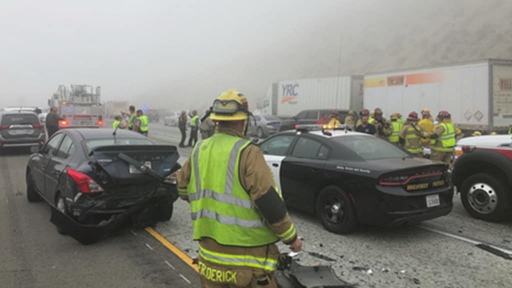 California accident scene during heavy fog conditions