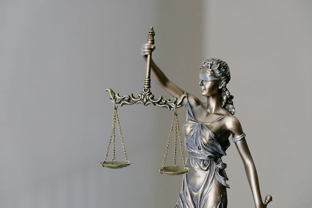 Lady Justice holding scales, symbolizing legal justice for fog accident victims