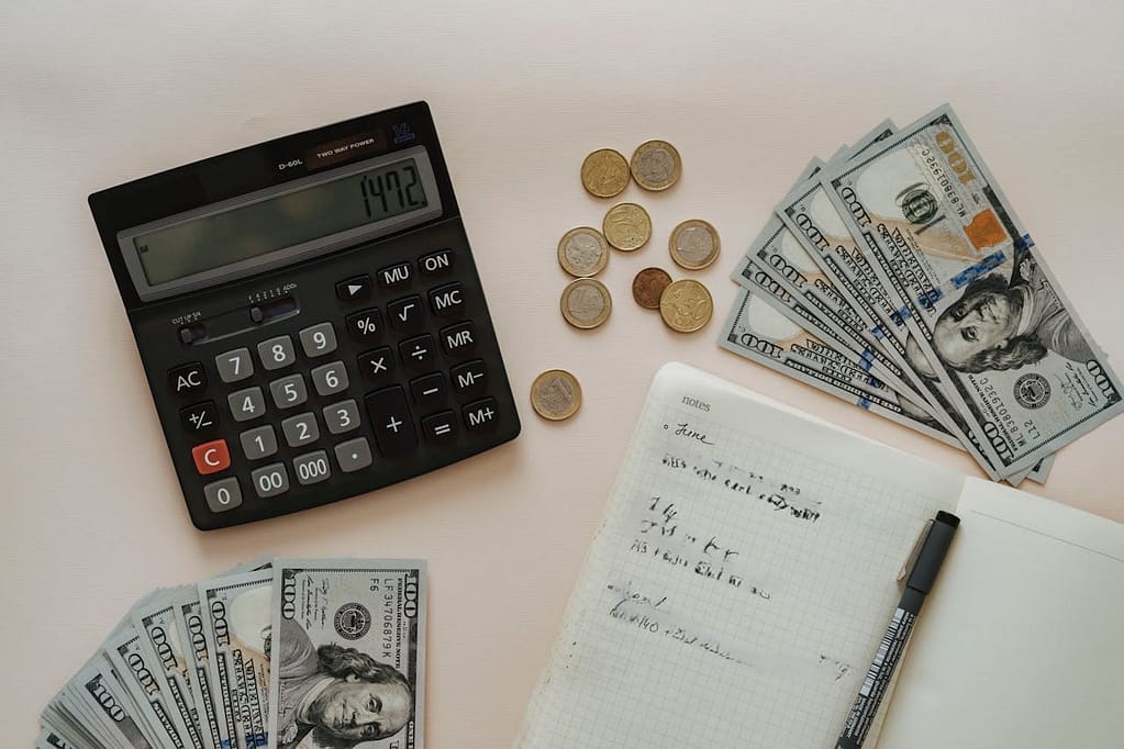 Budget planning for medical expenses after an accident using calculator and cash