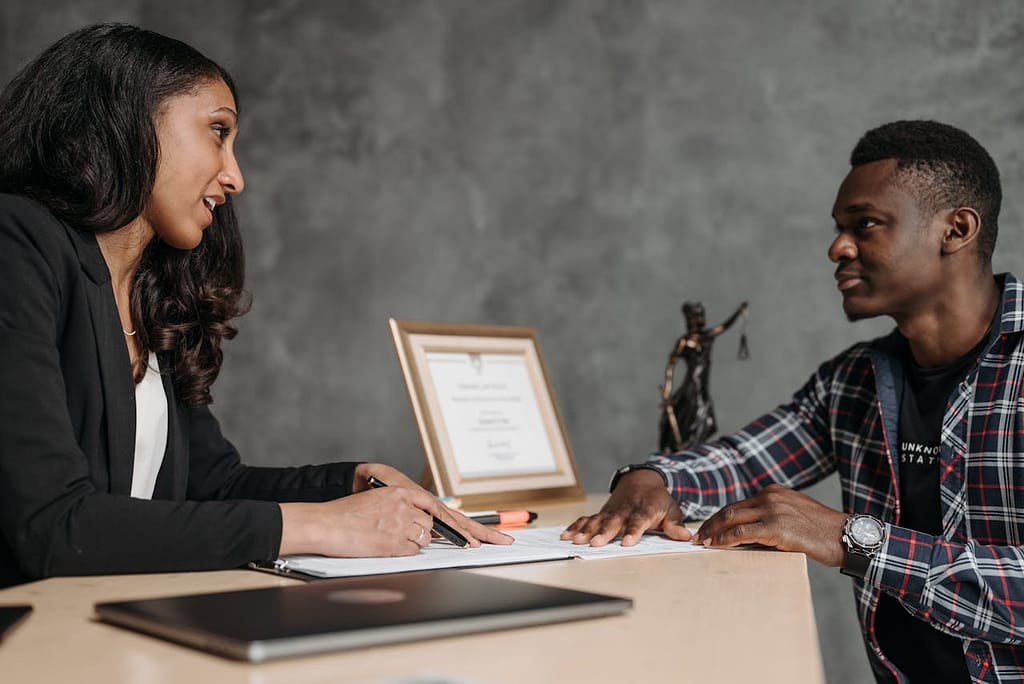 California lemon law attorney offering legal protection guidance to a client exploring car coverage options for a defective vehicle