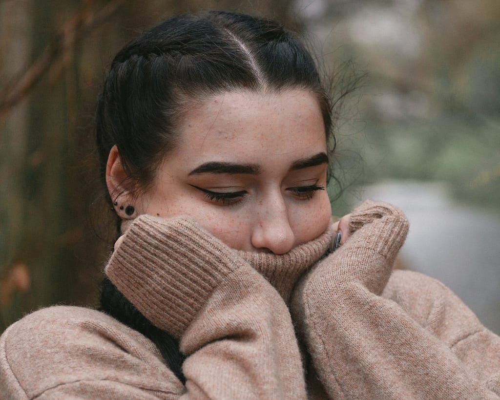 Young woman processing emotional shock after a California car accident