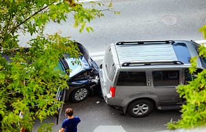 Two-vehicle rear-end collision involving shared fault on a California street.