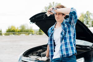 Mechanic diagnosing repeated engine issues that may qualify under California Lemon Law.